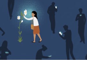 Digitaldetox:una persona si ferma ad osservare un fiore mentre gli altri guardano lo smartphona